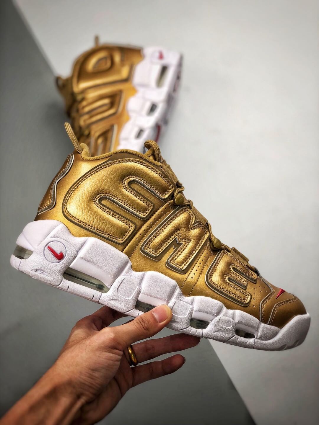 supreme x nike air more uptempo gold